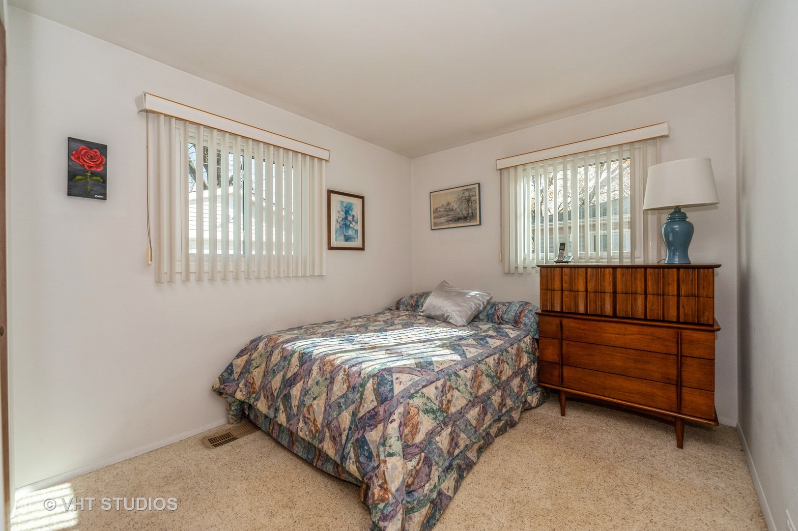 155 East Dennis Road Wheeling, IL 60090 - Photo 7 of 10 a bedroom with a bed and a window