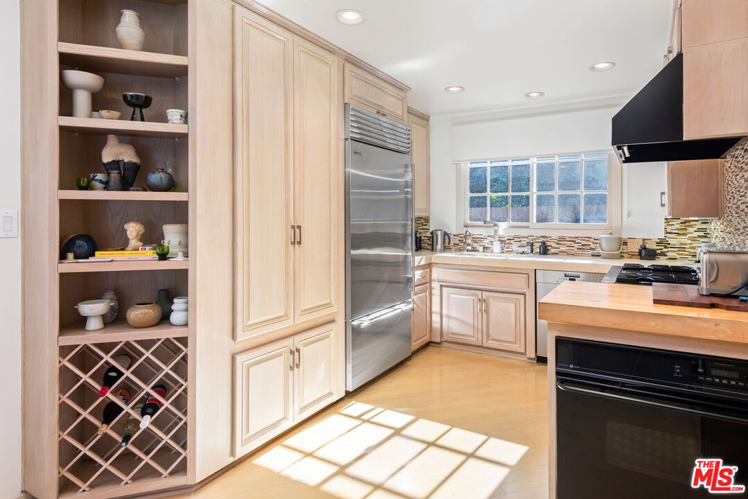 4247 Sespe Avenue Sherman Oaks, CA 91403 - Photo 13 of 31 a kitchen with a sink cabinets and window