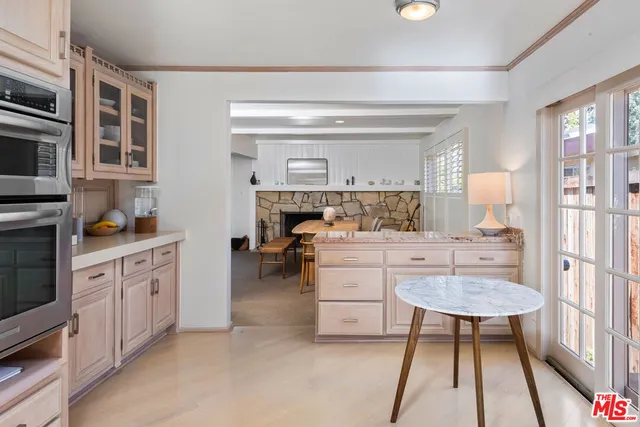 a room with furniture a rug and a window