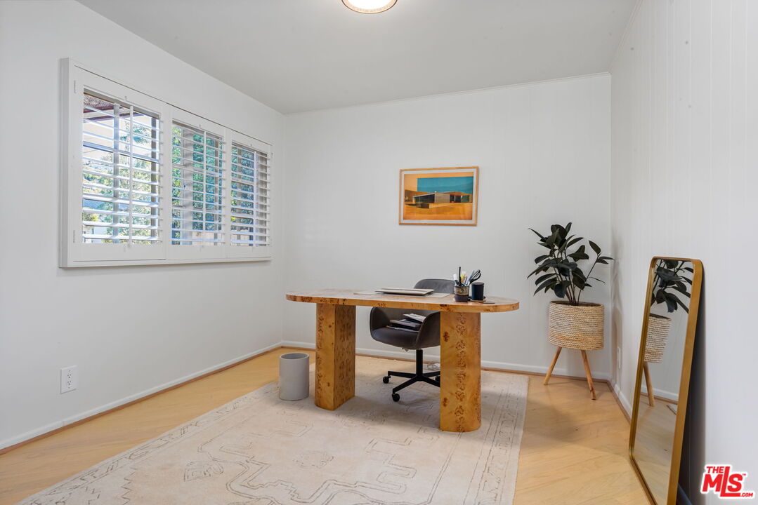 4247 Sespe Avenue Sherman Oaks, CA 91403 - Photo 16 of 31 a view of a workspace with furniture and a window