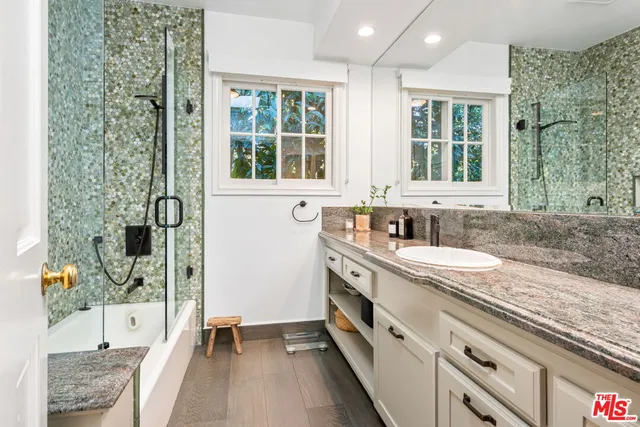 a kitchen with a sink and a large window