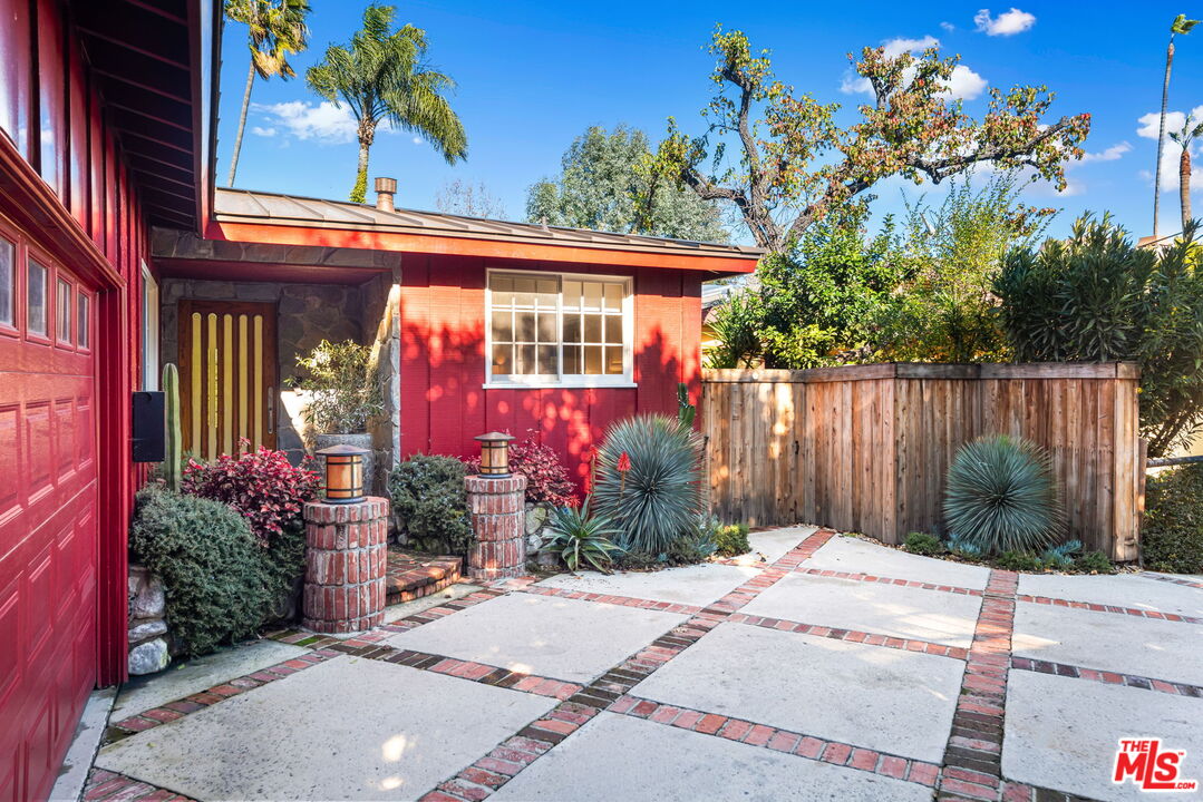 4247 Sespe Avenue Sherman Oaks, CA 91403 - Photo 2 of 31 a view of a house with a backyard and garden