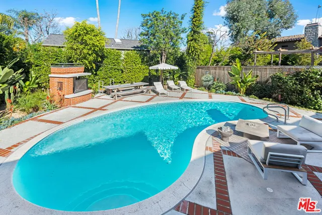a view of a swimming pool with chairs