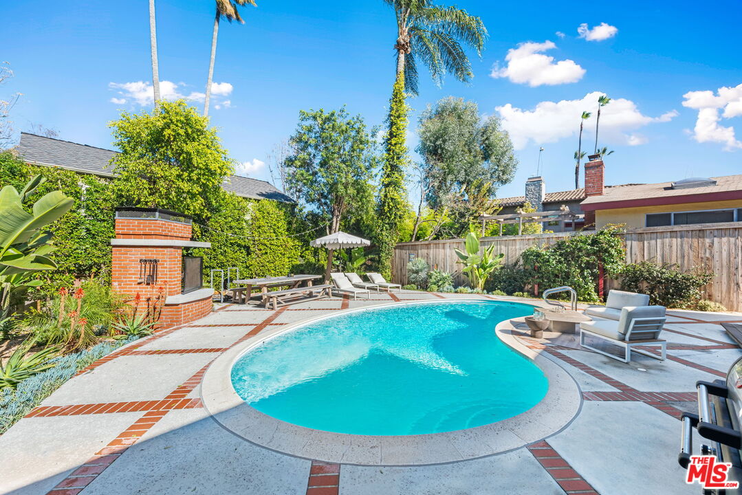 4247 Sespe Avenue Sherman Oaks, CA 91403 - Photo 28 of 31 a view of a swimming pool with a patio