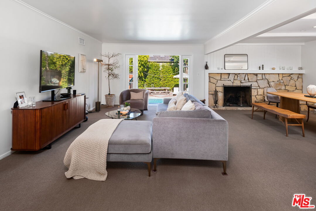 4247 Sespe Avenue Sherman Oaks, CA 91403 - Photo 4 of 31 a living room with furniture and a fireplace