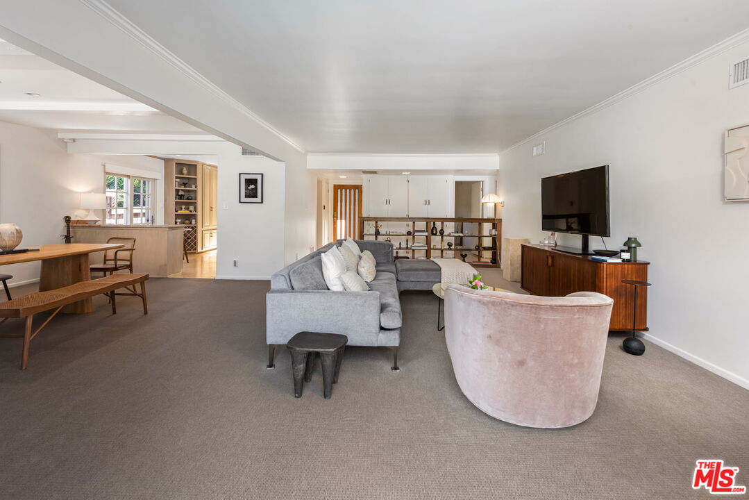 4247 Sespe Avenue Sherman Oaks, CA 91403 - Photo 6 of 31 a living room with furniture and a flat screen tv