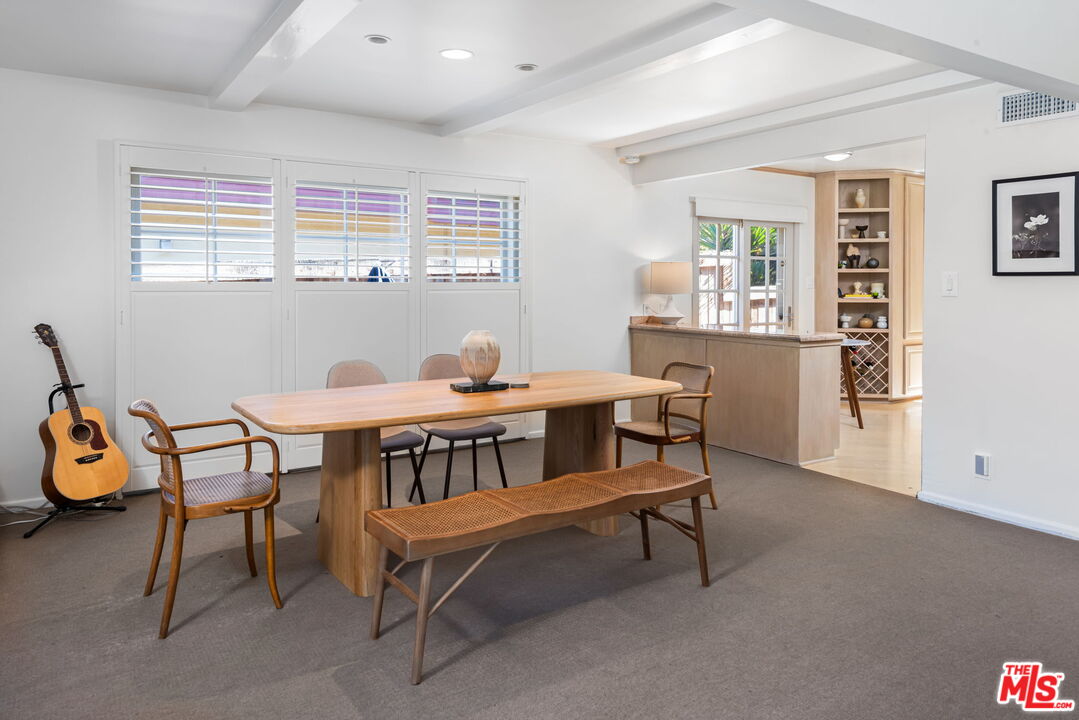 4247 Sespe Avenue Sherman Oaks, CA 91403 - Photo 7 of 31 a dining room with furniture and window