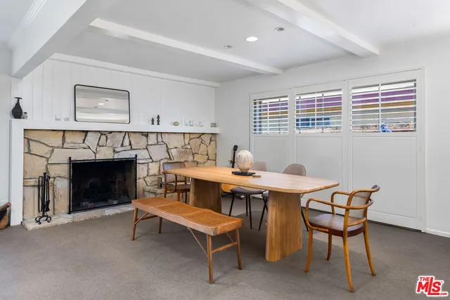 a view of a livingroom with furniture and a fireplace