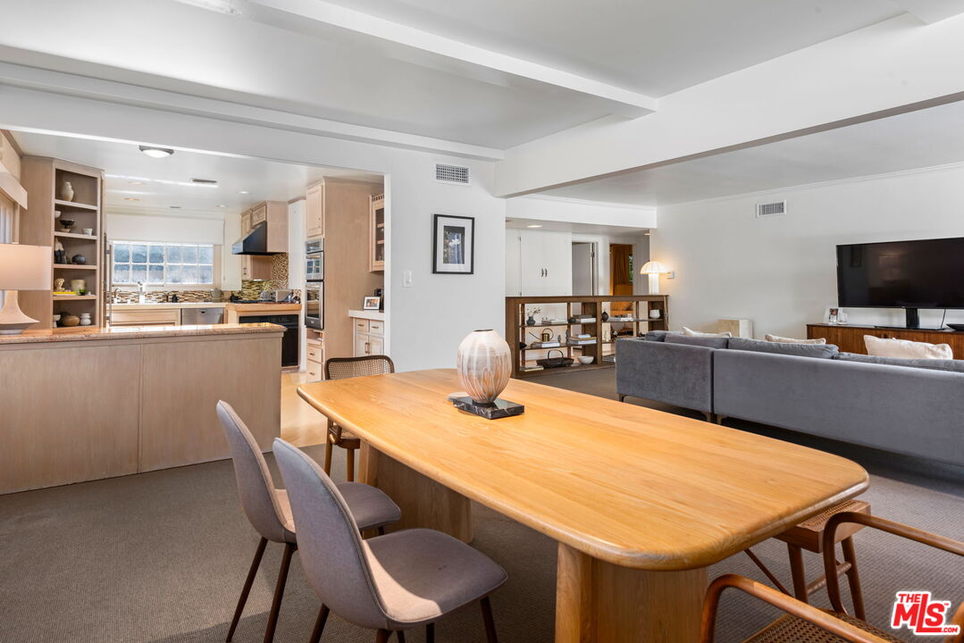 4247 Sespe Avenue Sherman Oaks, CA 91403 - Photo 10 of 31 a dining room with furniture and wooden floor