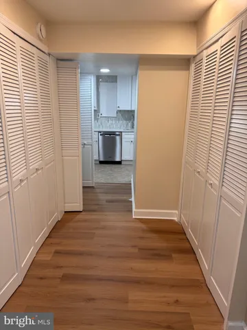 a view of a kitchen from wooden floor