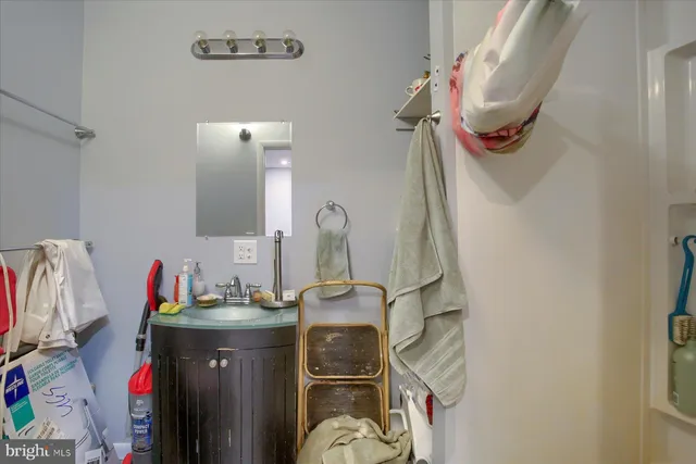 a bathroom with a sink and mirror
