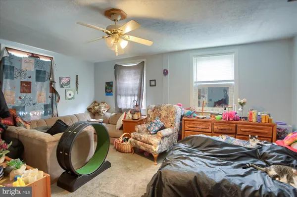 a bed room with bed and a chandelier