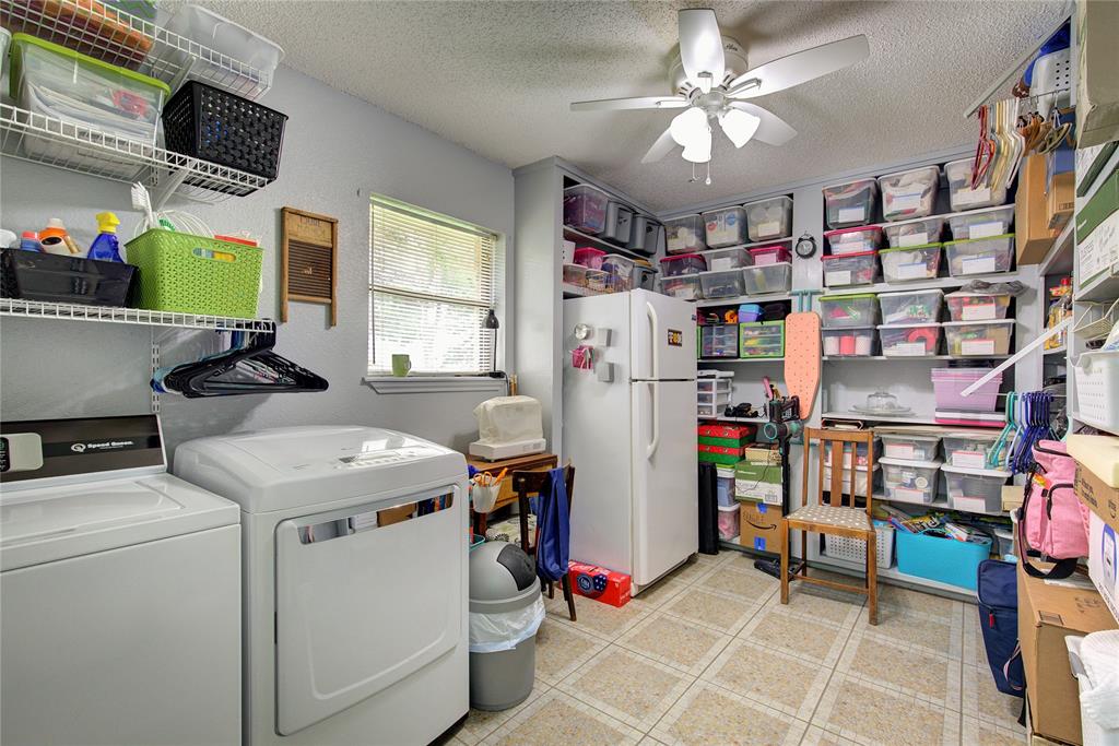 753 County Rd SW 3110 Mount Vernon, TX 75457 - Photo 19 of 40 Utility has space for freezer, lots of shelving for overflow pantry or linen storage.