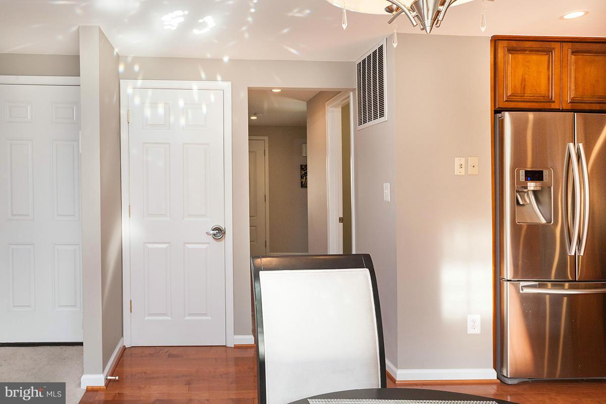 5750 Heming Avenue Springfield, VA 22151 - Photo 12 of 30 a view of hallway with stainless steel appliances granite countertop cabinets and a refrigerator