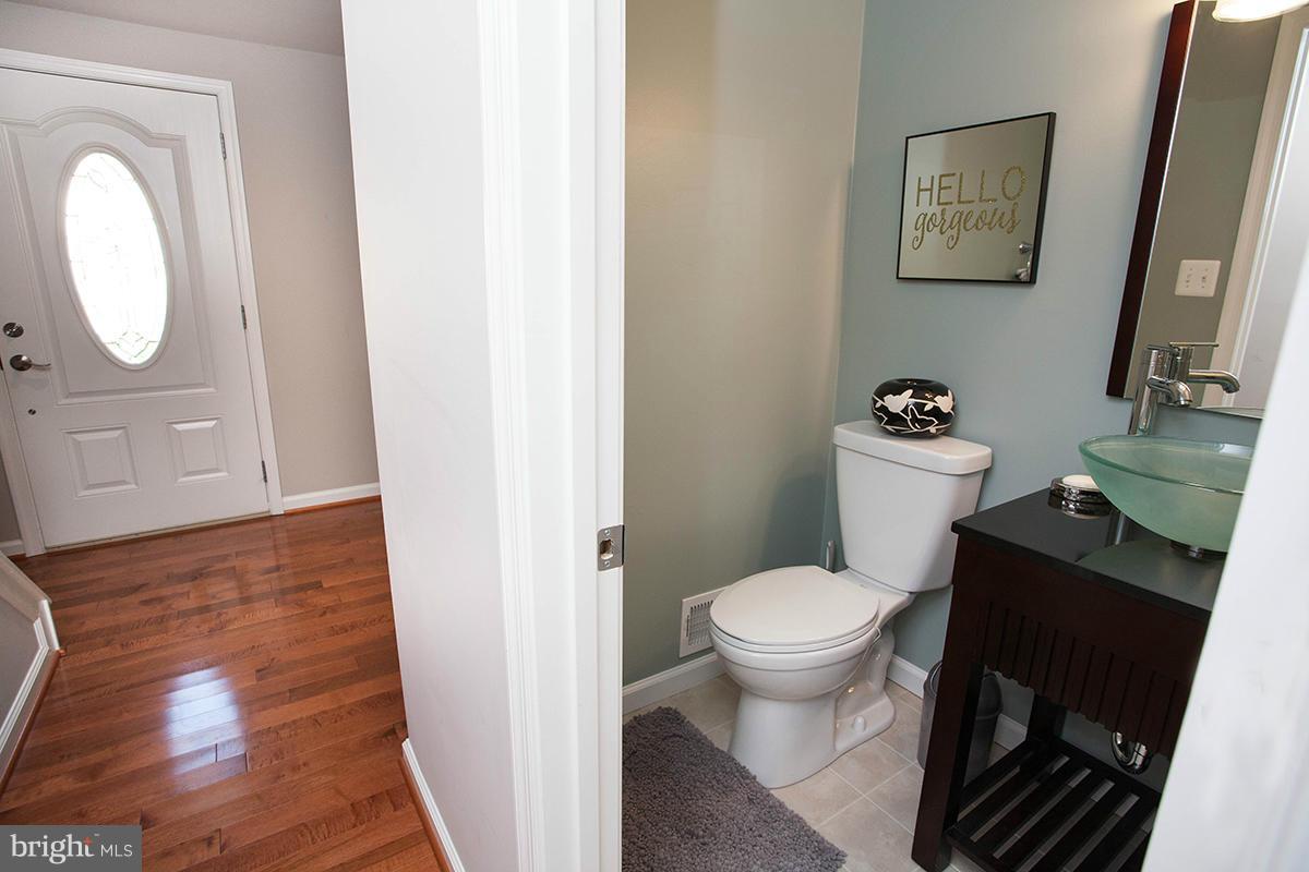 5750 Heming Avenue Springfield, VA 22151 - Photo 13 of 30 a bathroom with a toilet and a mirror