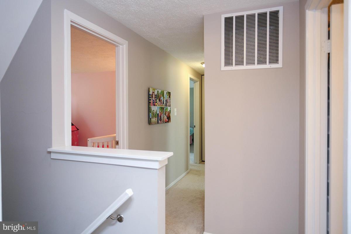 5750 Heming Avenue Springfield, VA 22151 - Photo 14 of 30 a bathroom with a sink and a mirror