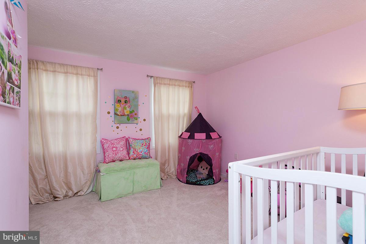 5750 Heming Avenue Springfield, VA 22151 - Photo 15 of 30 a view of a bedroom with a bed and toys