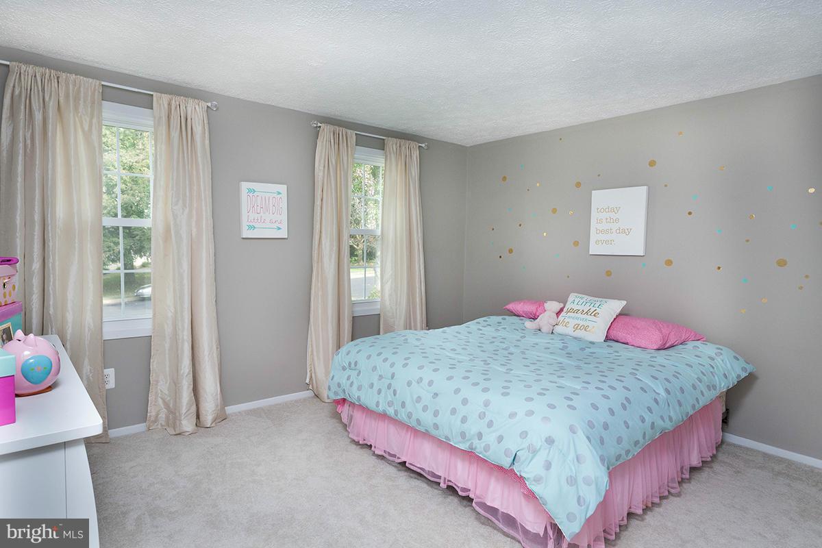 5750 Heming Avenue Springfield, VA 22151 - Photo 18 of 30 a bedroom with a bed and dresser