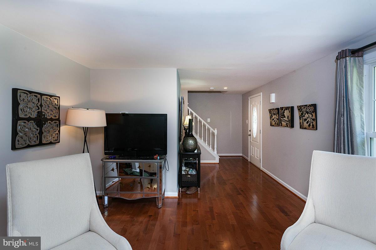 5750 Heming Avenue Springfield, VA 22151 - Photo 3 of 30 a living room with furniture and a flat screen tv