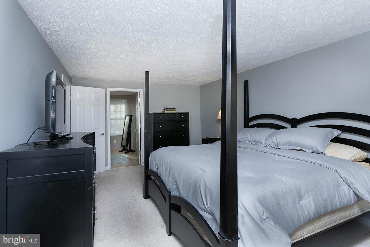 5750 Heming Avenue Springfield, VA 22151 - Photo 22 of 30 a bedroom with a bed and a dresser