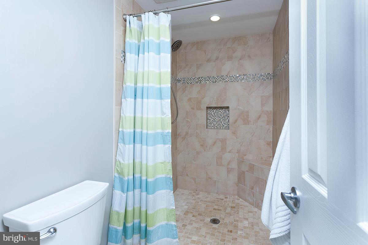 5750 Heming Avenue Springfield, VA 22151 - Photo 24 of 30 a bathroom with a shower and toilet