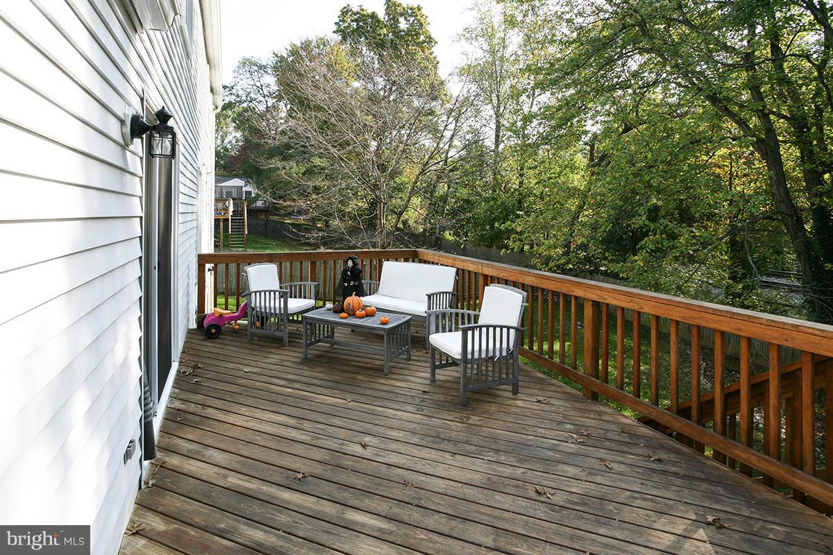 5750 Heming Avenue Springfield, VA 22151 - Photo 28 of 30 a view of balcony with wooden floor and outdoor seating