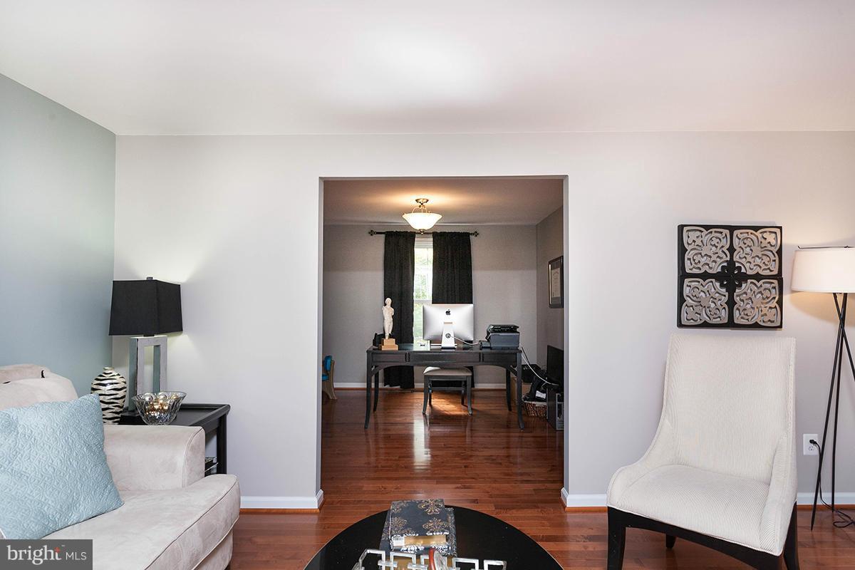 5750 Heming Avenue Springfield, VA 22151 - Photo 5 of 30 a dining room with furniture and wooden floor