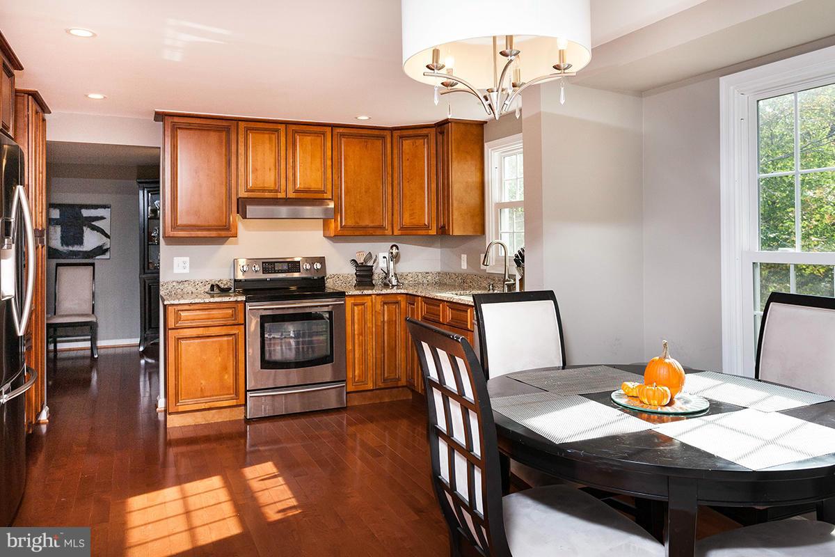 5750 Heming Avenue Springfield, VA 22151 - Photo 7 of 30 a kitchen with a stove a sink and a refrigerator