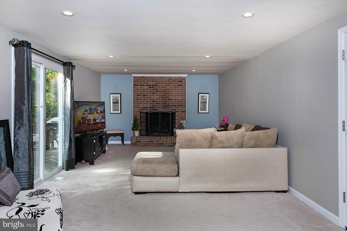 5750 Heming Avenue Springfield, VA 22151 - Photo 10 of 30 a living room with furniture and a fireplace