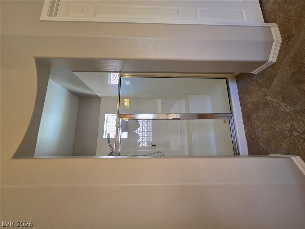 2567 Dirleton Place Henderson, NV 89044 - Photo 37 of 67 A well-appointed shower with glass enclosure offers a private bathing experience.