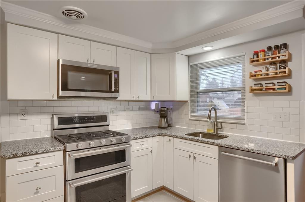 445 Rockhill Road Pittsburgh, PA 15243 - Photo 13 of 31 a kitchen with granite countertop cabinets stainless steel appliances and a sink