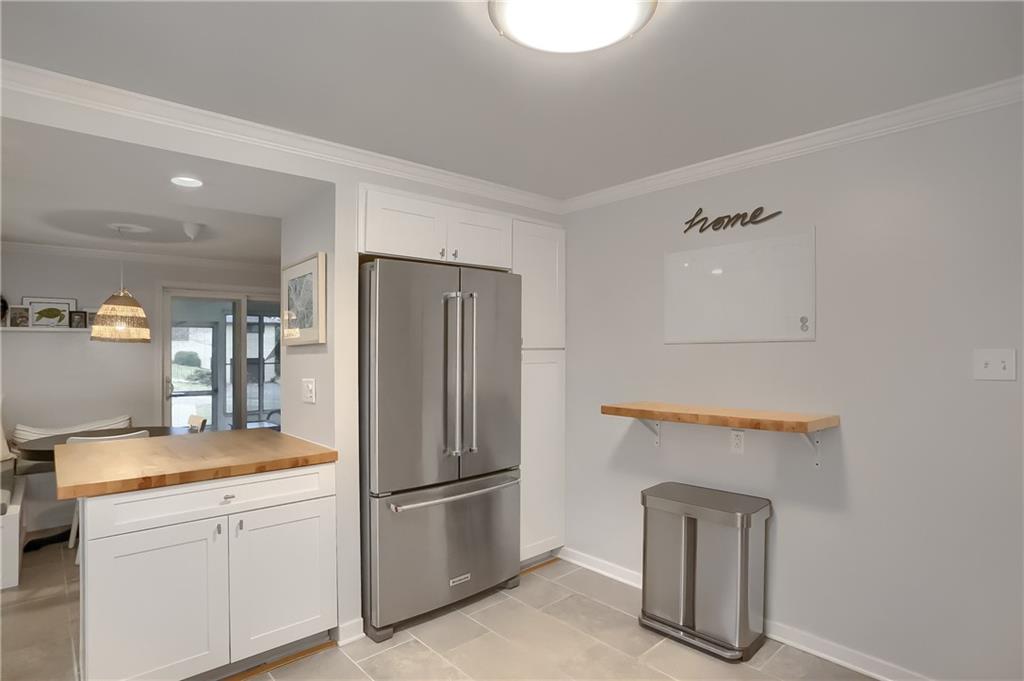 445 Rockhill Road Pittsburgh, PA 15243 - Photo 14 of 31 a kitchen with a refrigerator and a stove
