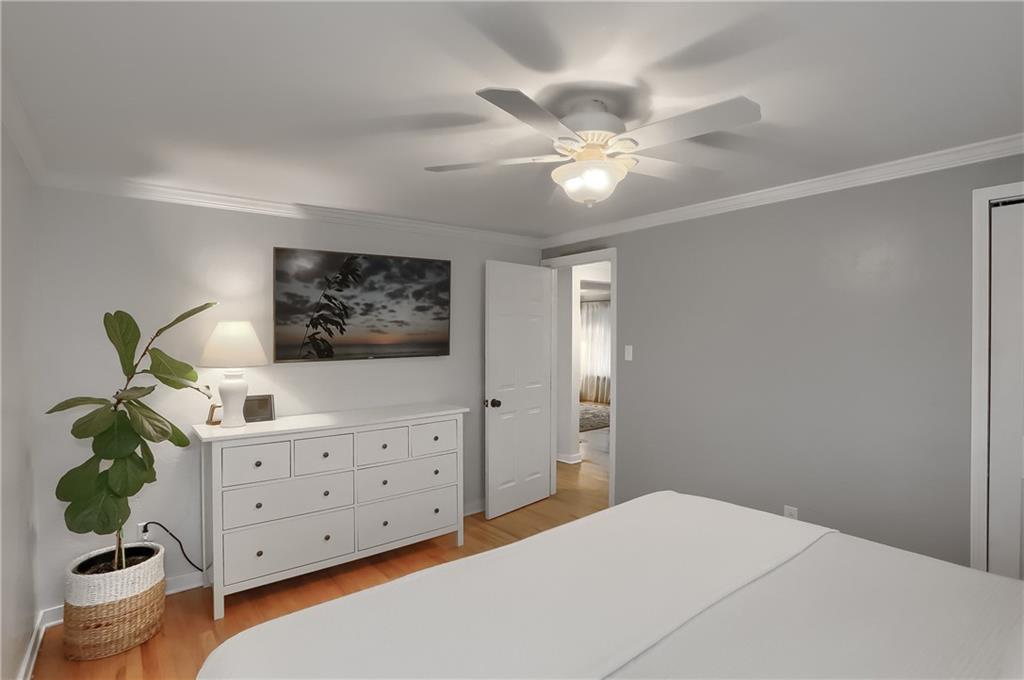 445 Rockhill Road Pittsburgh, PA 15243 - Photo 16 of 31 a bedroom with a bed and a chandelier