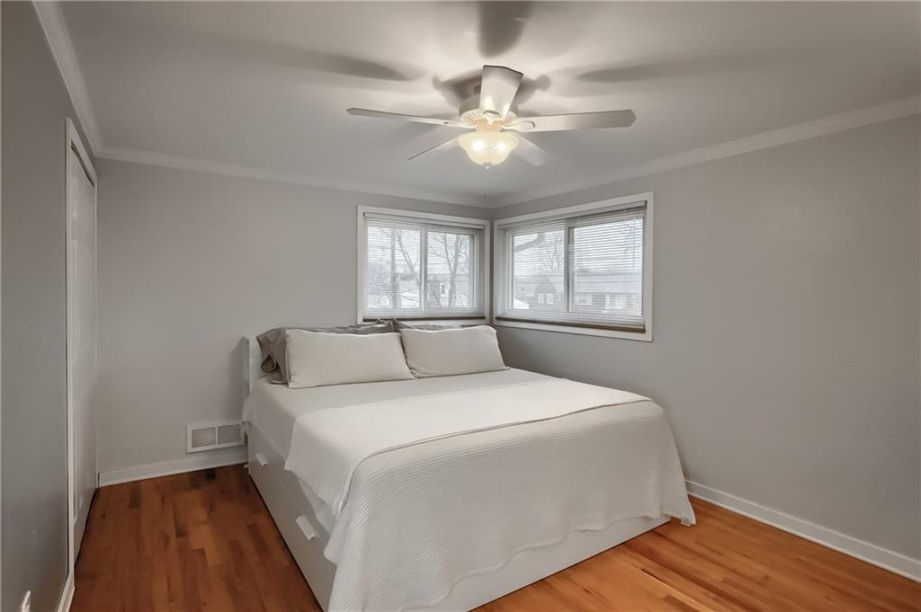445 Rockhill Road Pittsburgh, PA 15243 - Photo 18 of 31 a bedroom with a large bed and a window