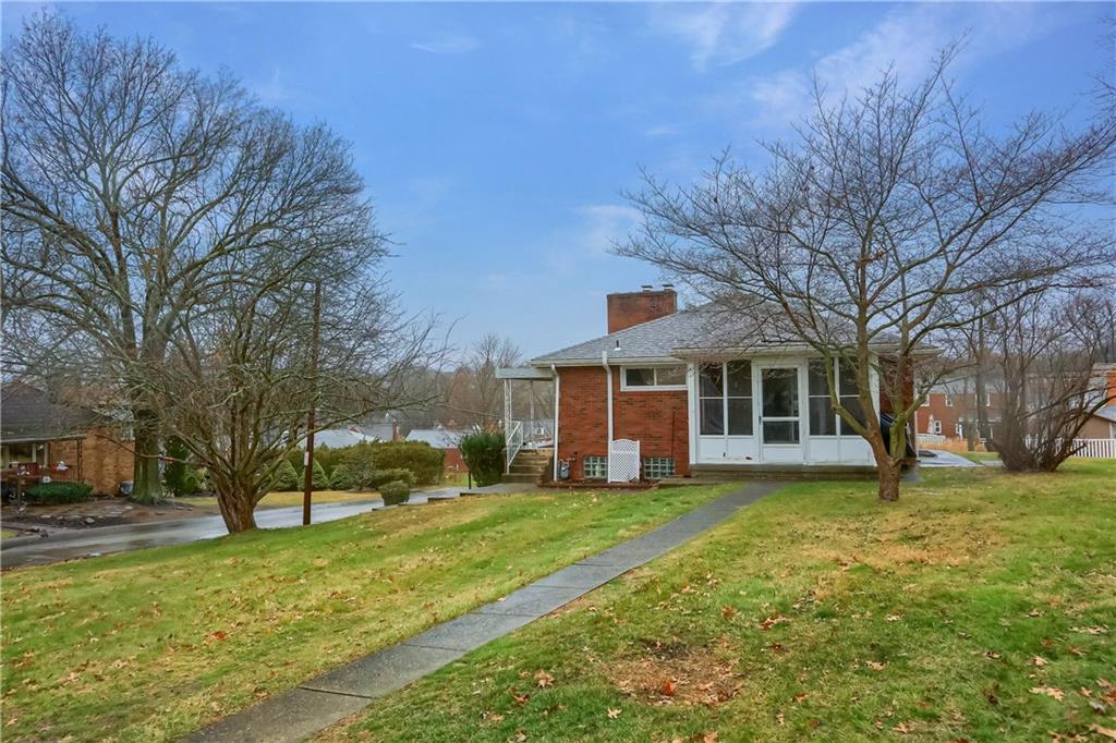 445 Rockhill Road Pittsburgh, PA 15243 - Photo 2 of 31 a view of a house with a yard and a large tree