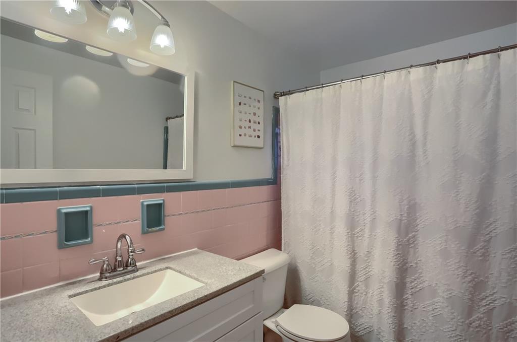 445 Rockhill Road Pittsburgh, PA 15243 - Photo 22 of 31 a bathroom with a sink and a mirror
