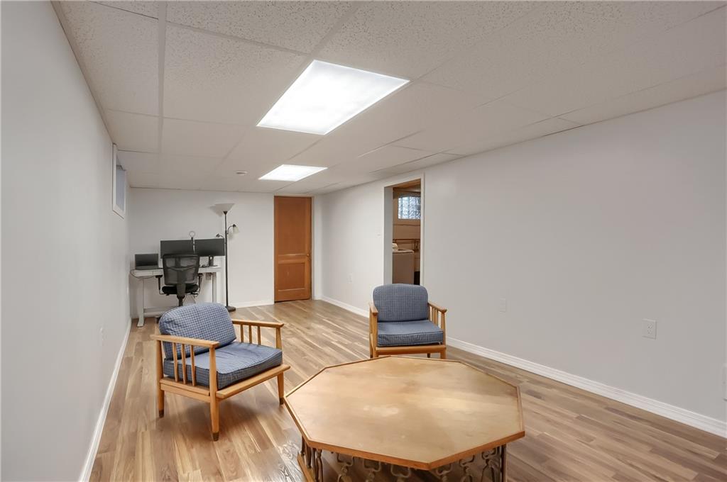 445 Rockhill Road Pittsburgh, PA 15243 - Photo 24 of 31 a living room with furniture and a wooden floor
