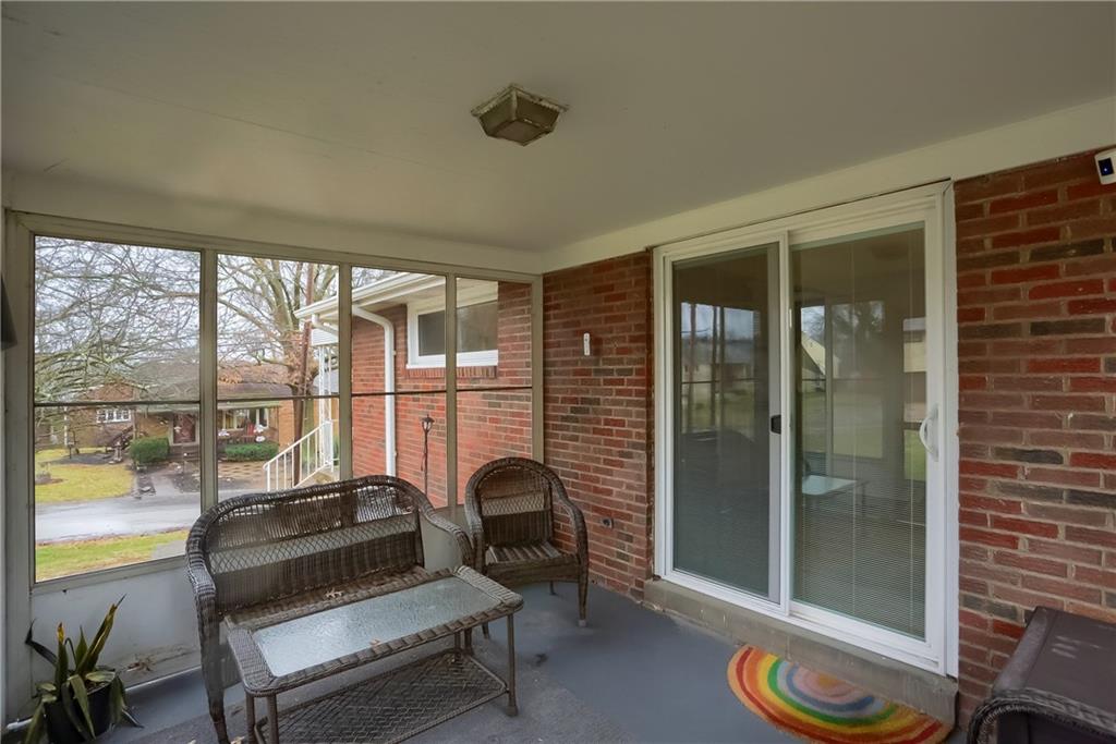 445 Rockhill Road Pittsburgh, PA 15243 - Photo 28 of 31 a living room with furniture and a floor to ceiling window