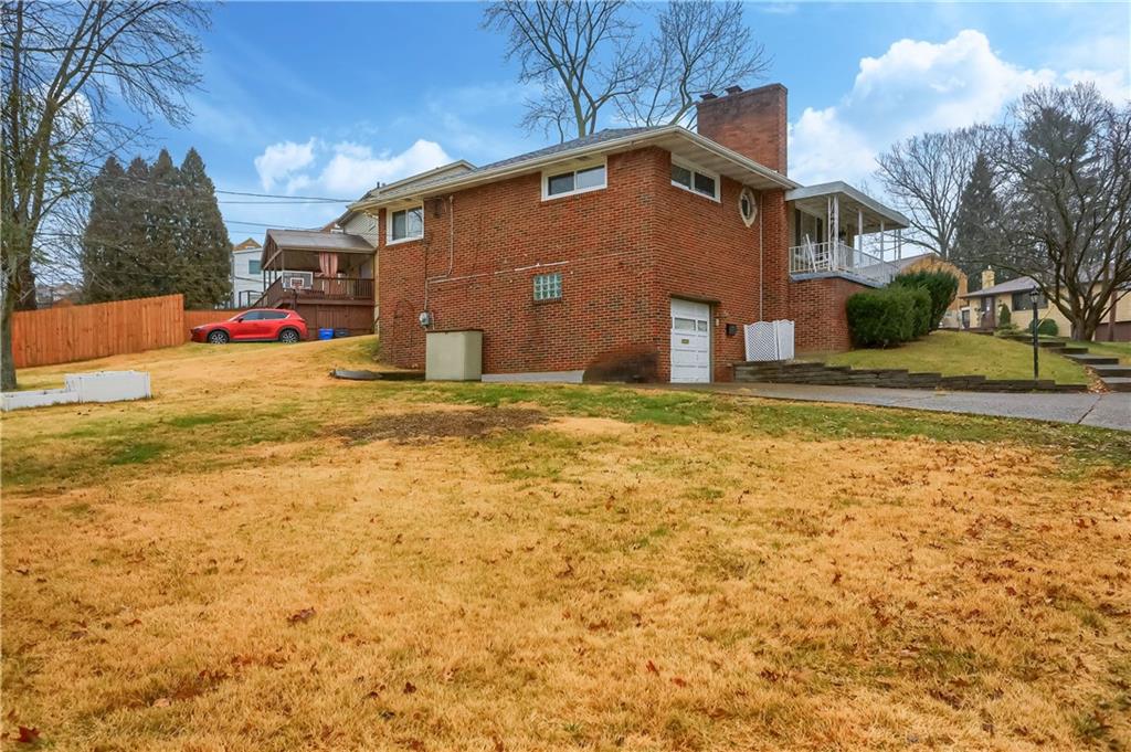 445 Rockhill Road Pittsburgh, PA 15243 - Photo 30 of 31 a front view of a house with a yard