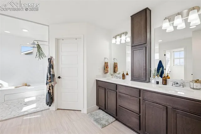 a white bath tub sitting next to a white toilet