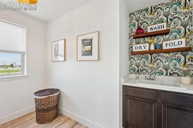 a view of livingroom with washer and dryer