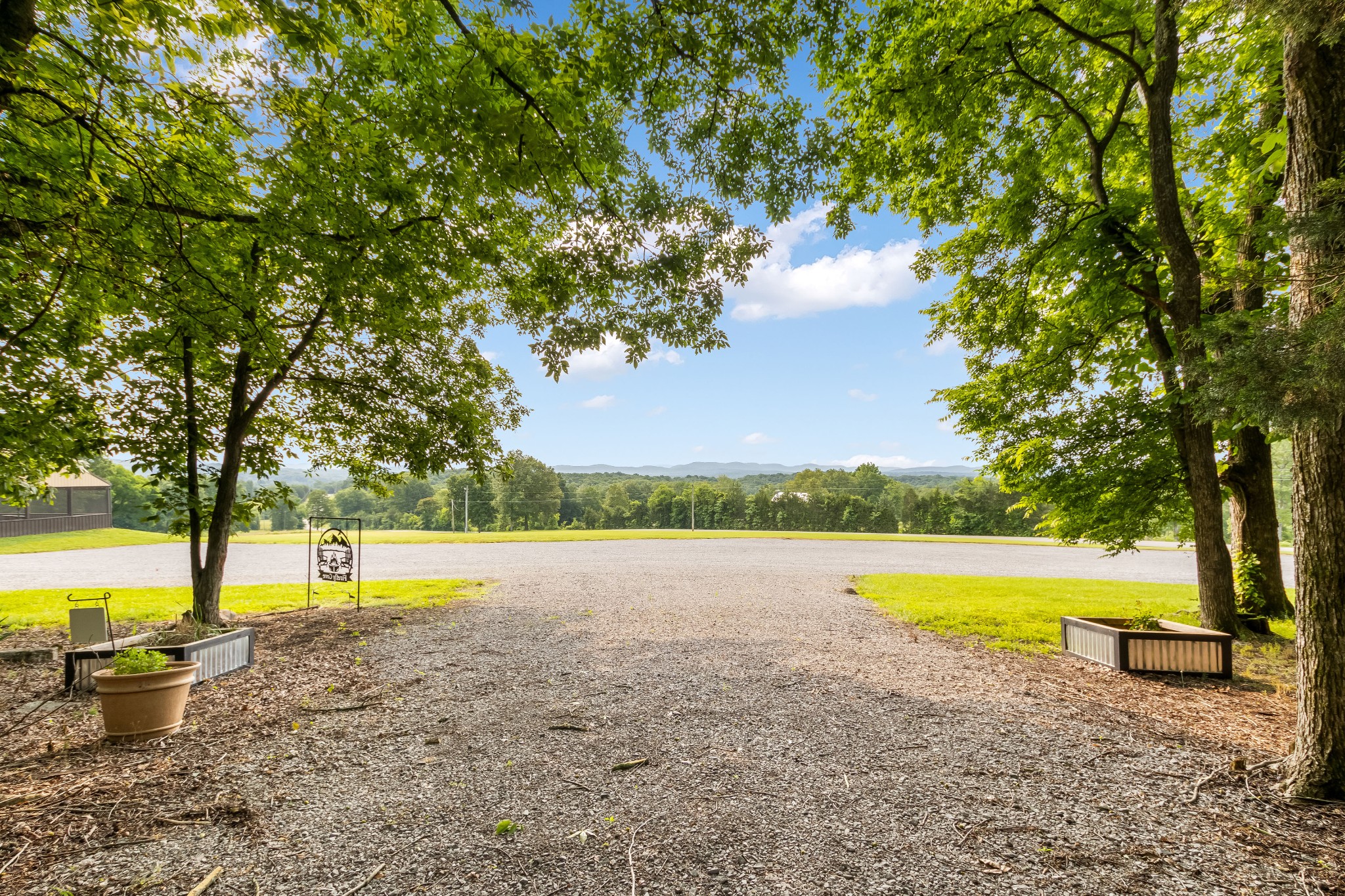 1049 Oregon Road Lascassas, TN 37085 - Photo 2 of 100 a view of a swimming pool with an outdoor space and seating area