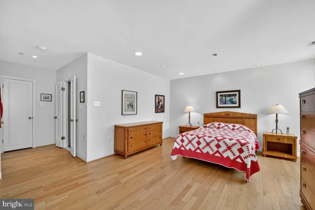 a bedroom with a bed and dresser