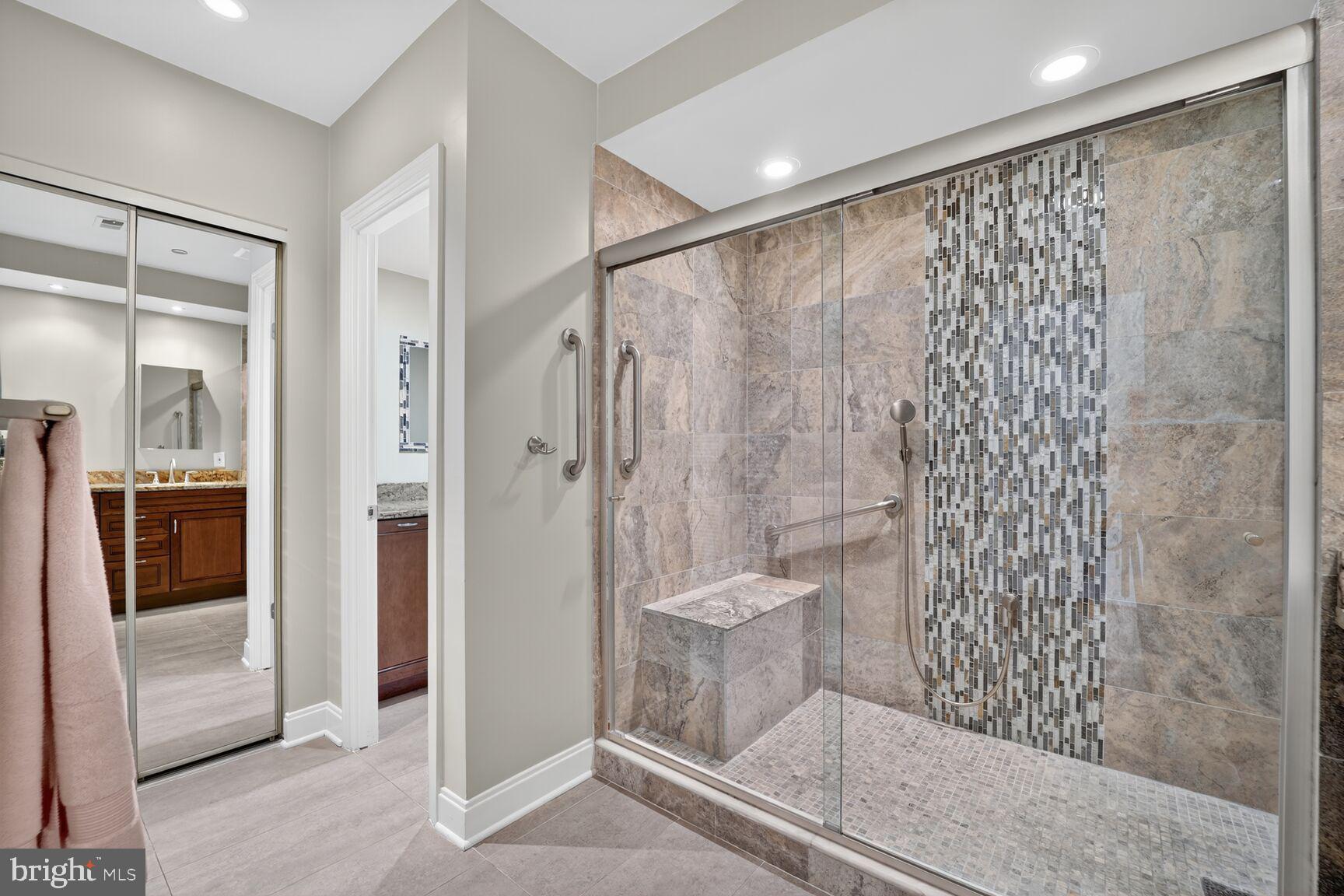 4550 North Park Avenue, Unit 1005 Chevy Chase, MD 20815 - Photo 22 of 30 a bathroom with a shower and a toilet