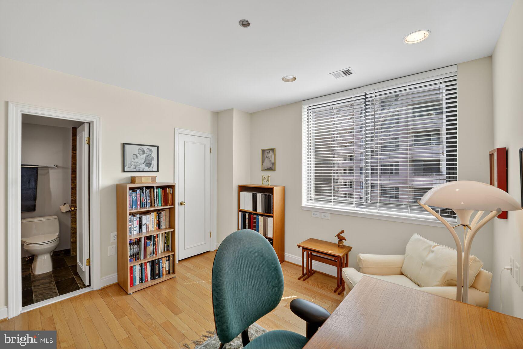4550 North Park Avenue, Unit 1005 Chevy Chase, MD 20815 - Photo 25 of 30 a living room with furniture and a window