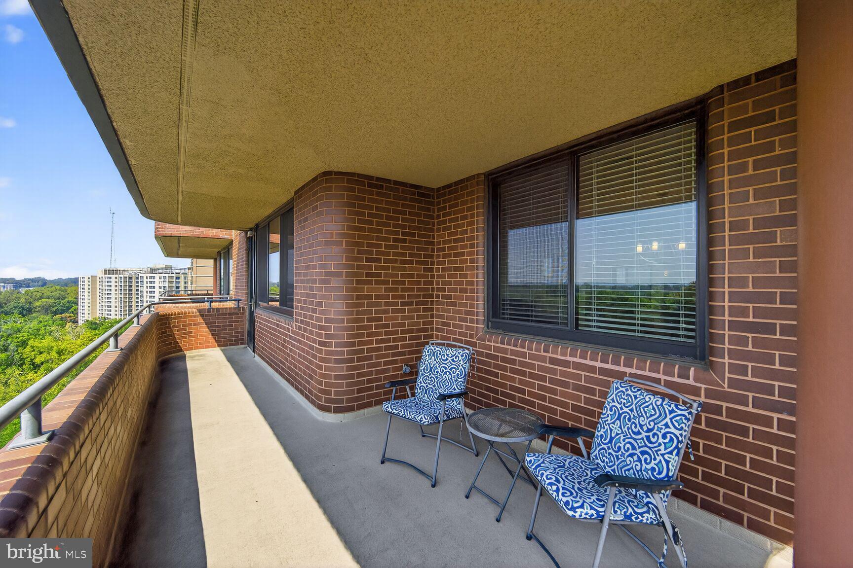 4550 North Park Avenue, Unit 1005 Chevy Chase, MD 20815 - Photo 7 of 30 a view of two chairs in the balcony