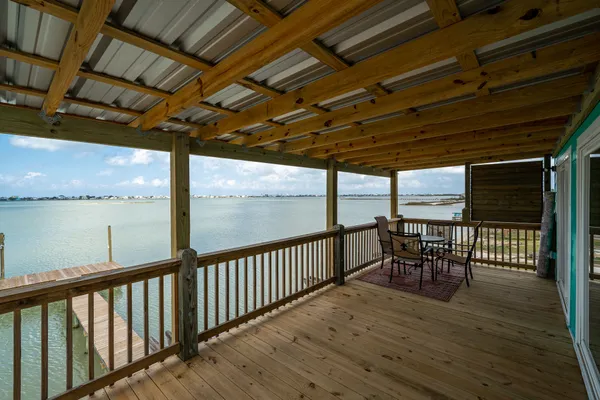 a view of a roof deck with wooden floor