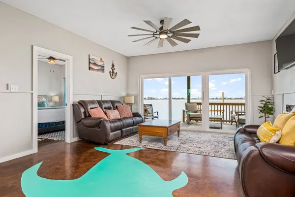a living room with furniture and a large window