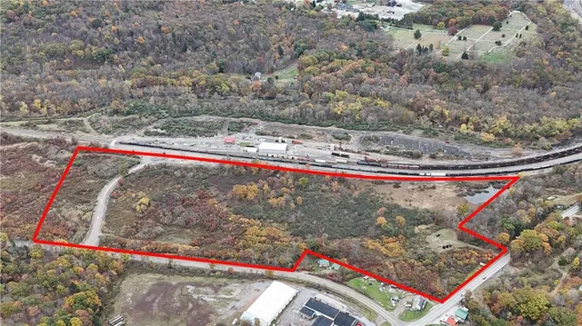 a view of a dry yard with mountains