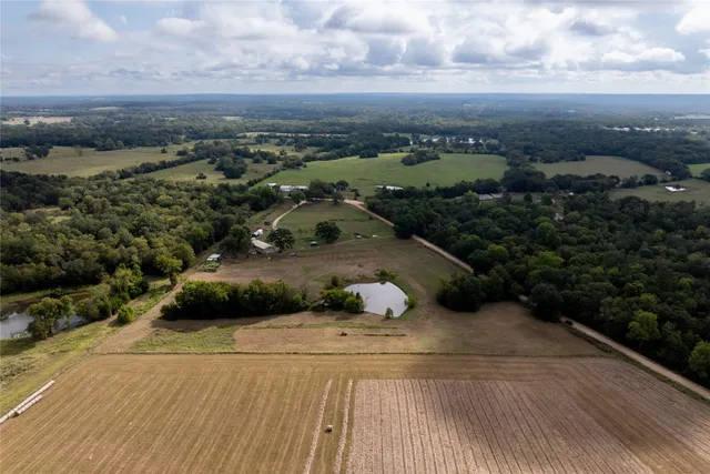 an aerial view of a houses with outdoor space